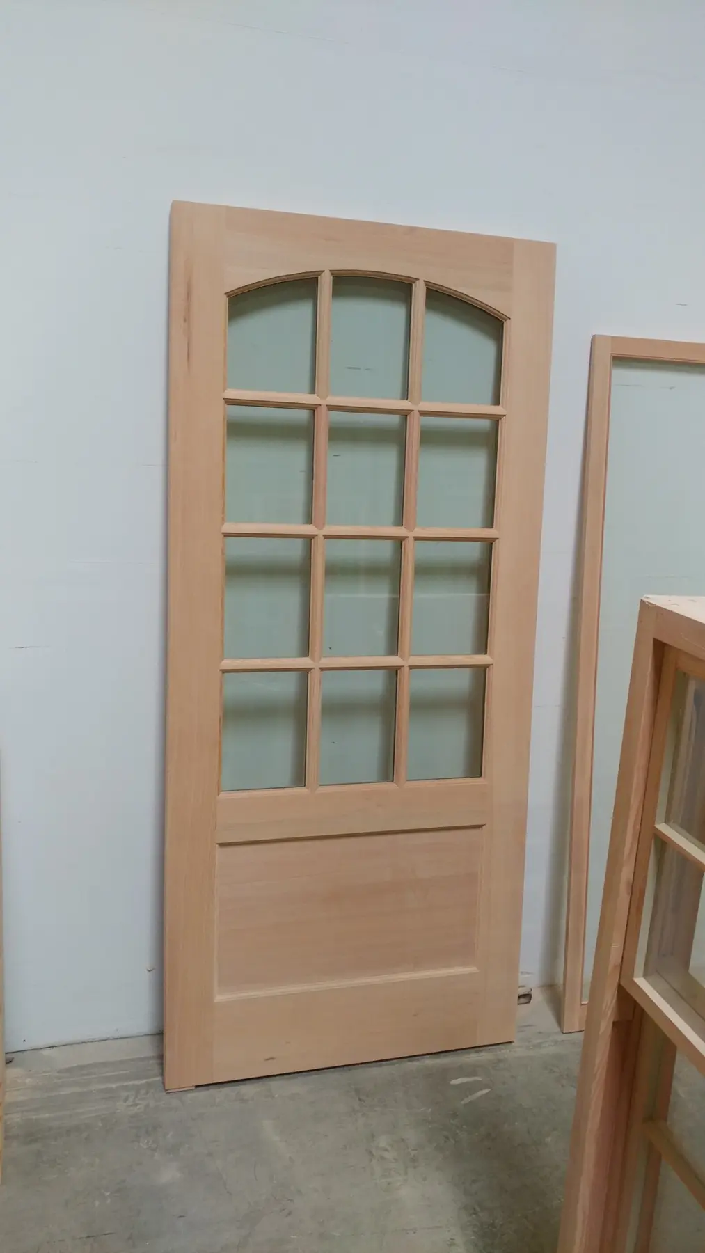 Unfinished custom wood door with divided lites