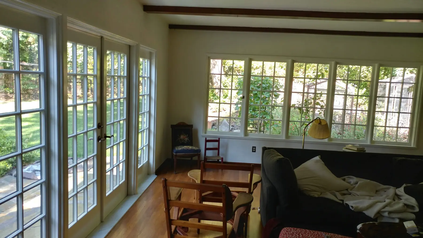 Interior room lined with custom divided-lite wood windows